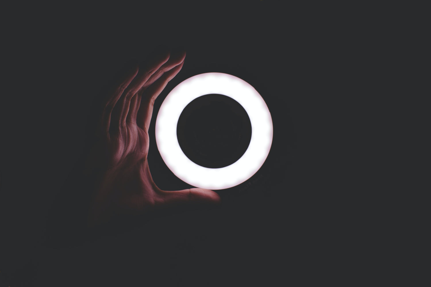 hand holding ring light